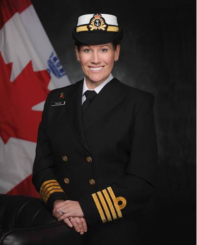 Janice Taylor in Royal Canadian Navy uniform with Canadian flag